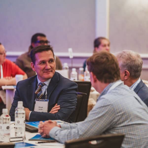 Business conference attendees having a discussion.