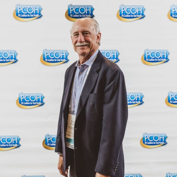 Man at PCOH oral health event.