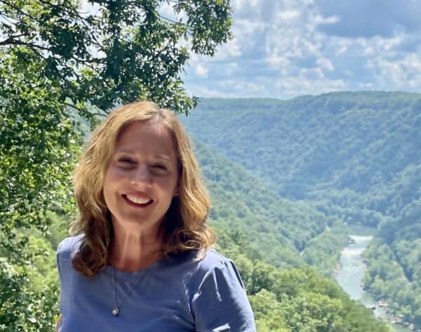 Woman smiling with scenic mountain view