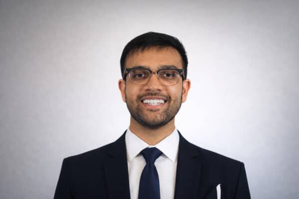 Smiling man in suit and glasses portrait